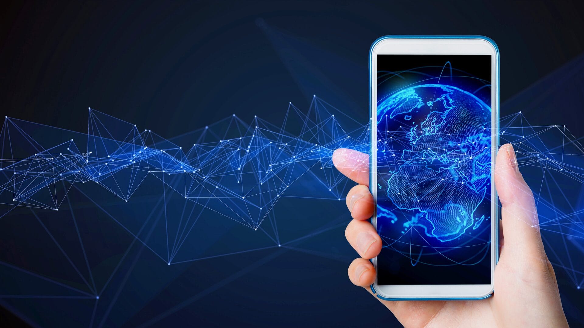 Hand holding a smartphone displaying a digital Earth, with interconnected lines symbolizing global mobile connectivity and international market expansion.