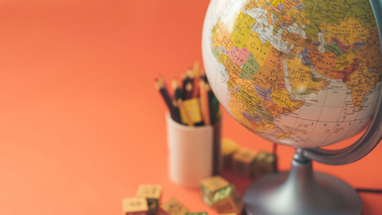 Globe on an orange background | Phrase