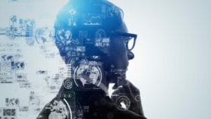 Silhouette of a business professional with futuristic data visualizations and global maps overlayed, representing the use of AI tools and analytics in global business expansion and localization efforts.